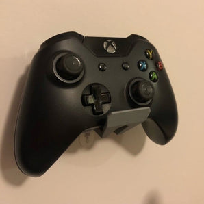 Supporto a parete per controller di gioco con strisce Command