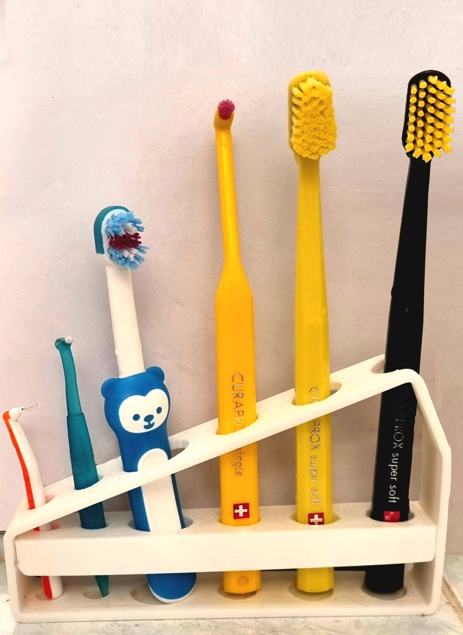 Porta-spazzolino per 3 spazzolini Curaprox e 1 spazzolino per bambini