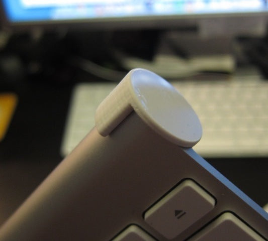 Copertura del pulsante di accensione per la tastiera wireless Apple