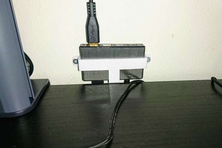 Supporto a parete per hub USB Icybox IB-AC610 a 4 porte
