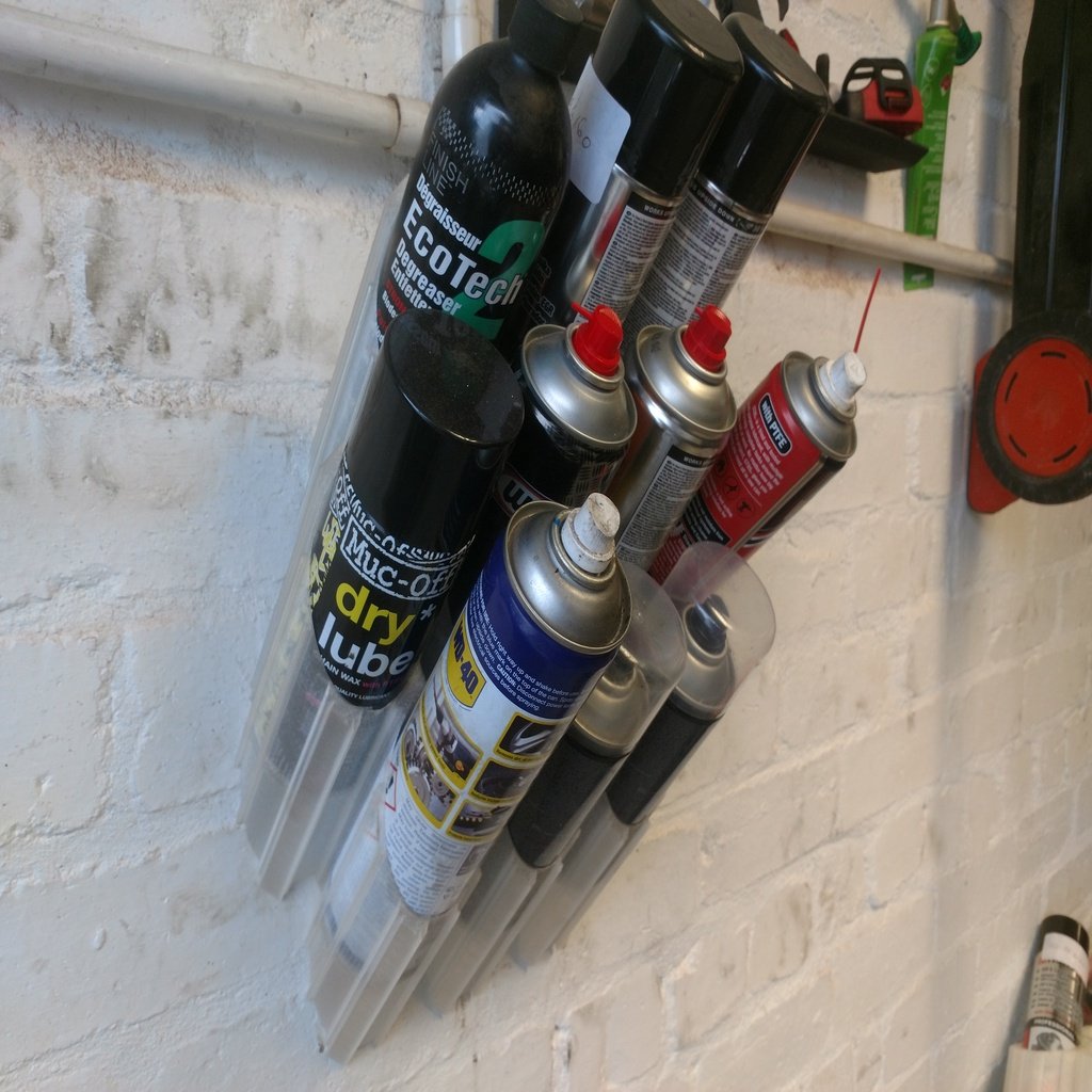 Supporto per bombolette spray per montaggio a parete